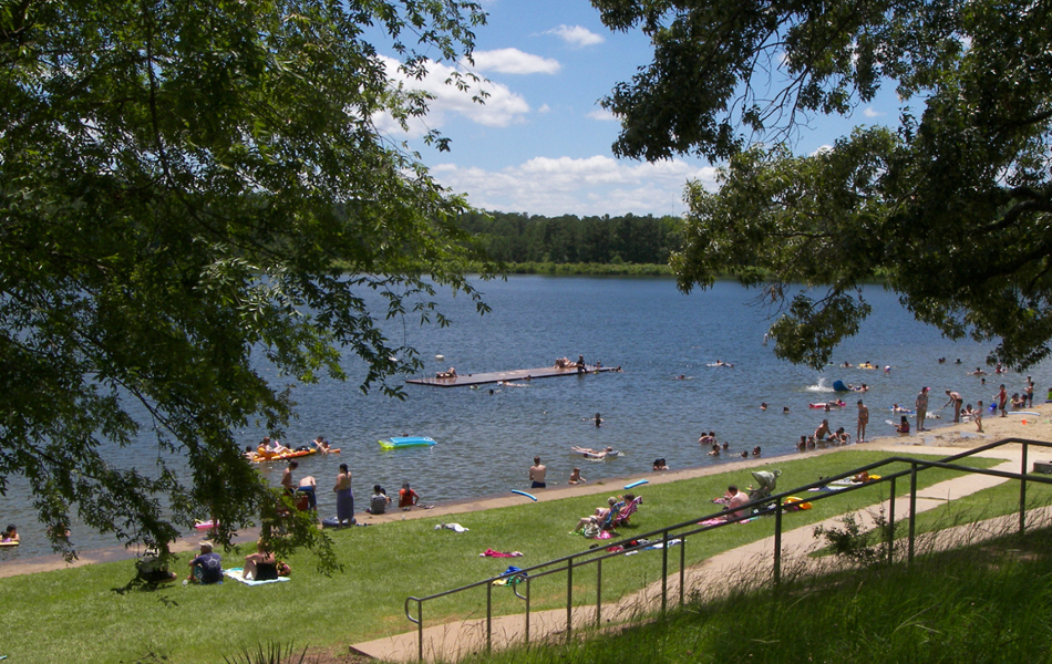 People swiming and playing in an outdoor Park